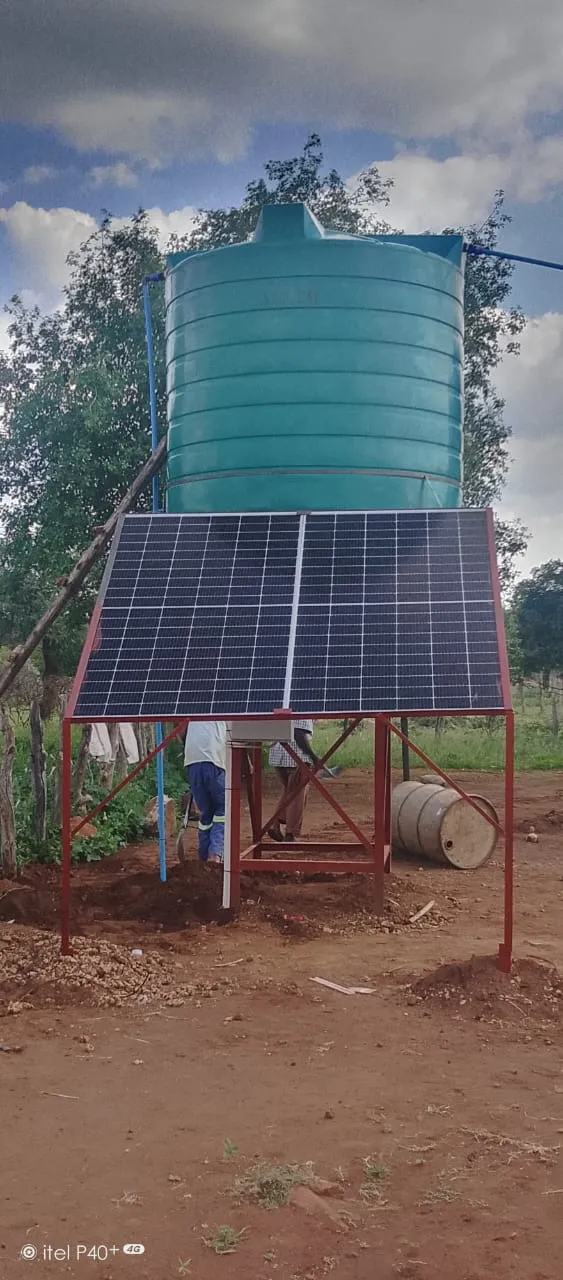 Solar water pumping system with ground-mounted panels and storage tank installed by Danford Electrical